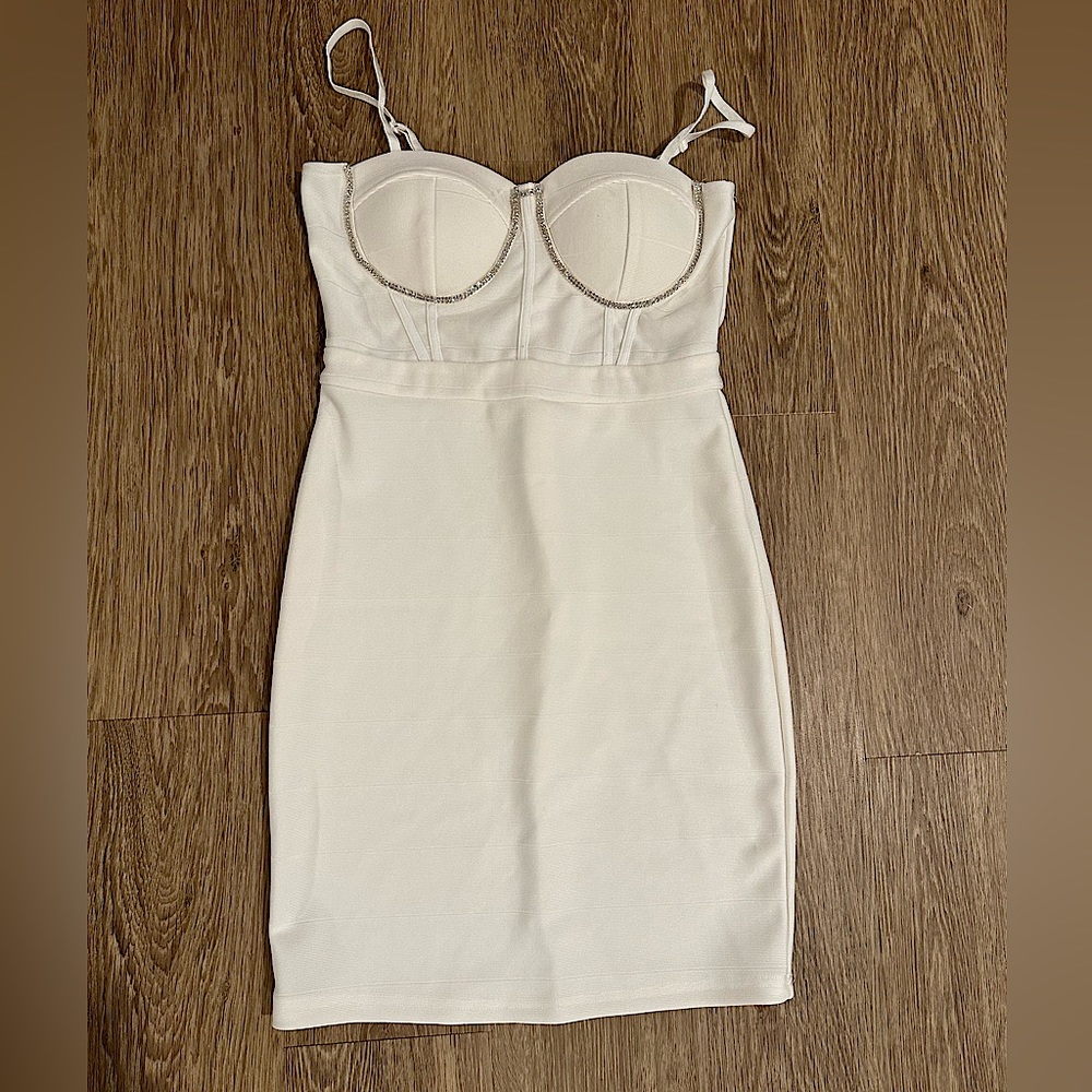 Bought for my bachelorette party but never wore. Cute white bodycon dress